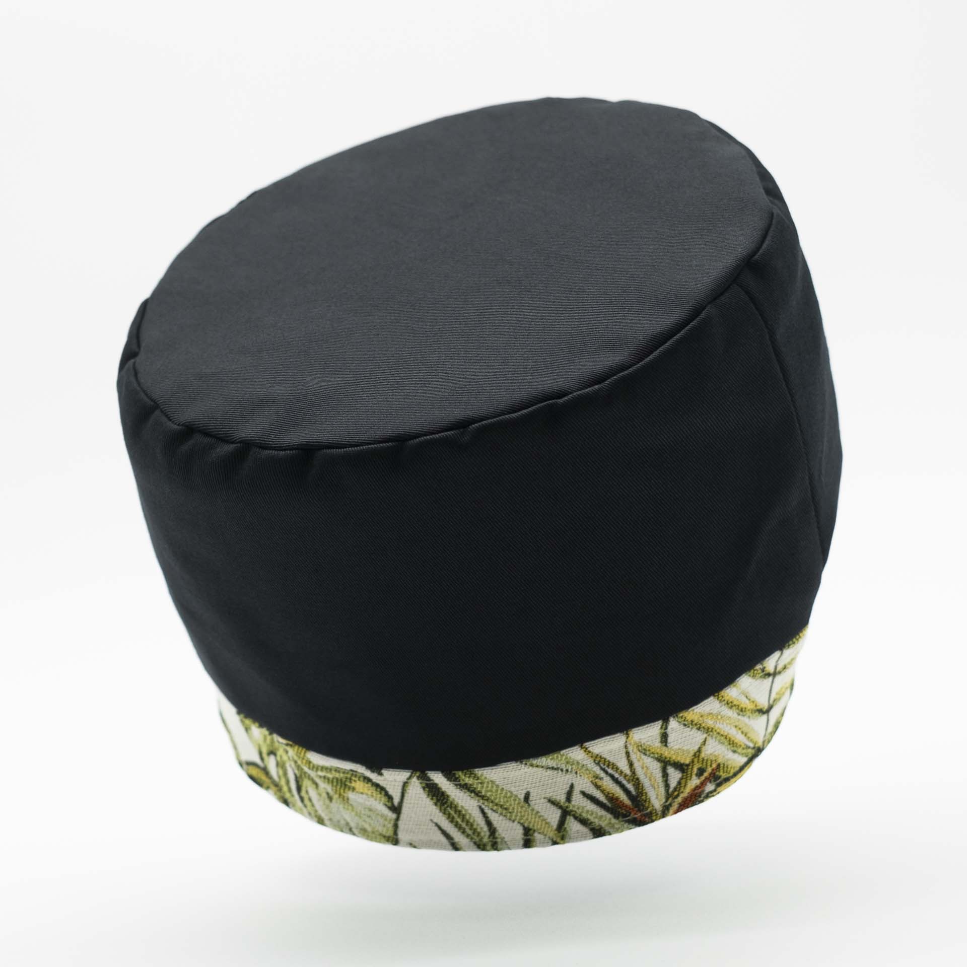 Traditional Rasta hat for dreadlocks in black cotton accompanied by a thin headband in tropical jungle weaving at the bottom of the hat with black cotton lining