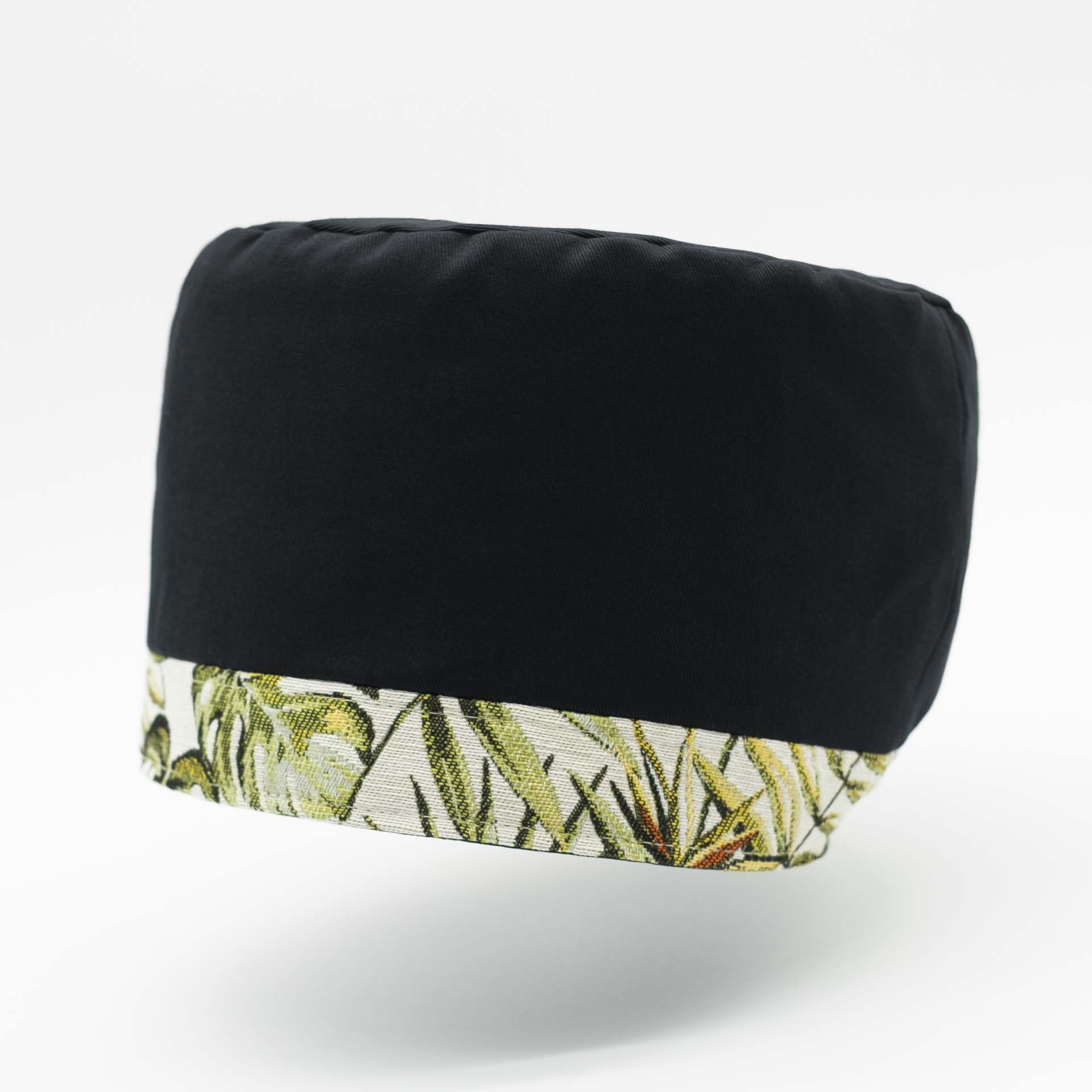 Traditional Rasta hat for dreadlocks in black cotton accompanied by a thin headband in tropical jungle weaving at the bottom of the hat with black cotton lining