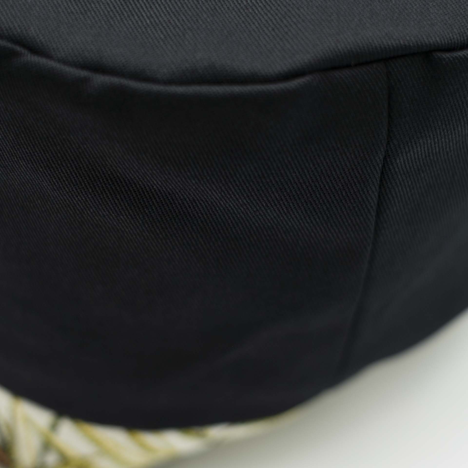 Traditional Rasta hat for dreadlocks in black cotton accompanied by a thin headband in tropical jungle weaving at the bottom of the hat with black cotton lining