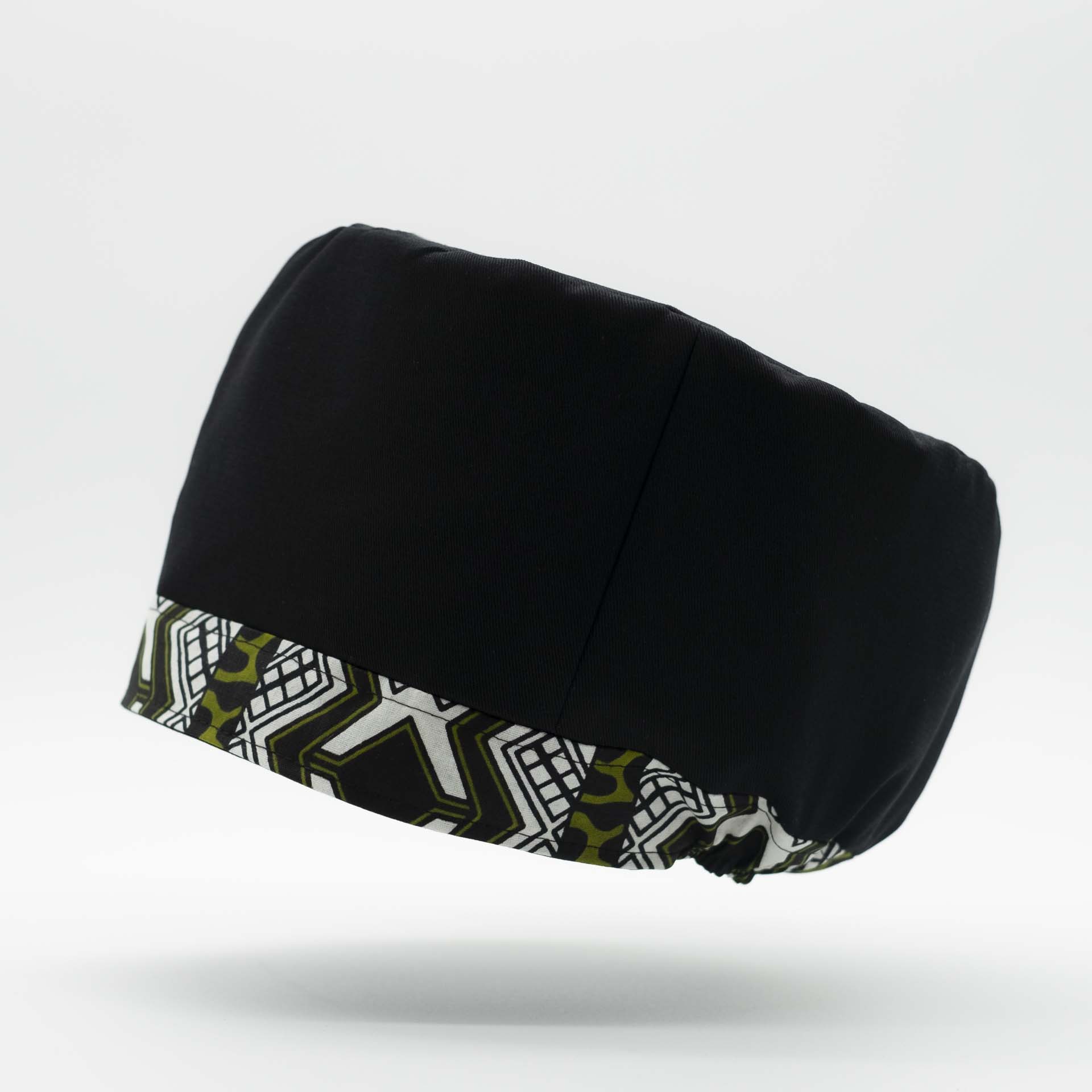 Traditional Rasta hat for dreadlocks in black cotton with ethnic motifs accompanied by a thin colored headband in wax cotton on the bottom of the hat with black lining