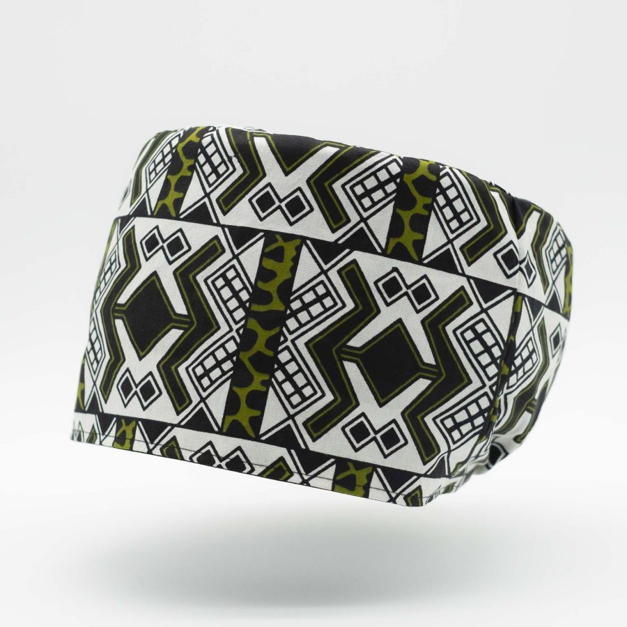 Hat for dreadlocks without visor in light African wax fabric colored green white black with ethnic patterns. Black cotton lining