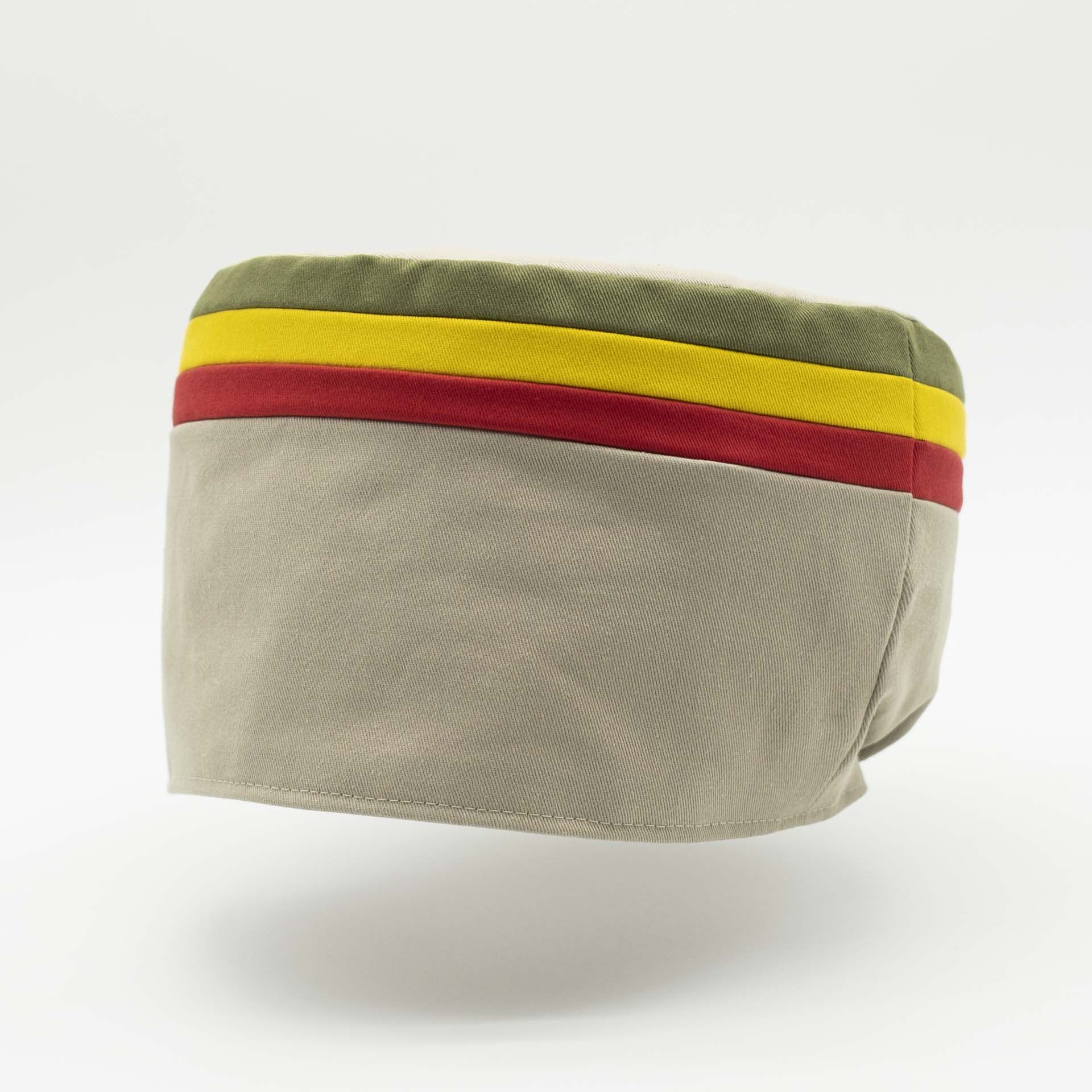 Rasta crown without visor. Beige cotton with red gold and green stripes at the top of the tam.