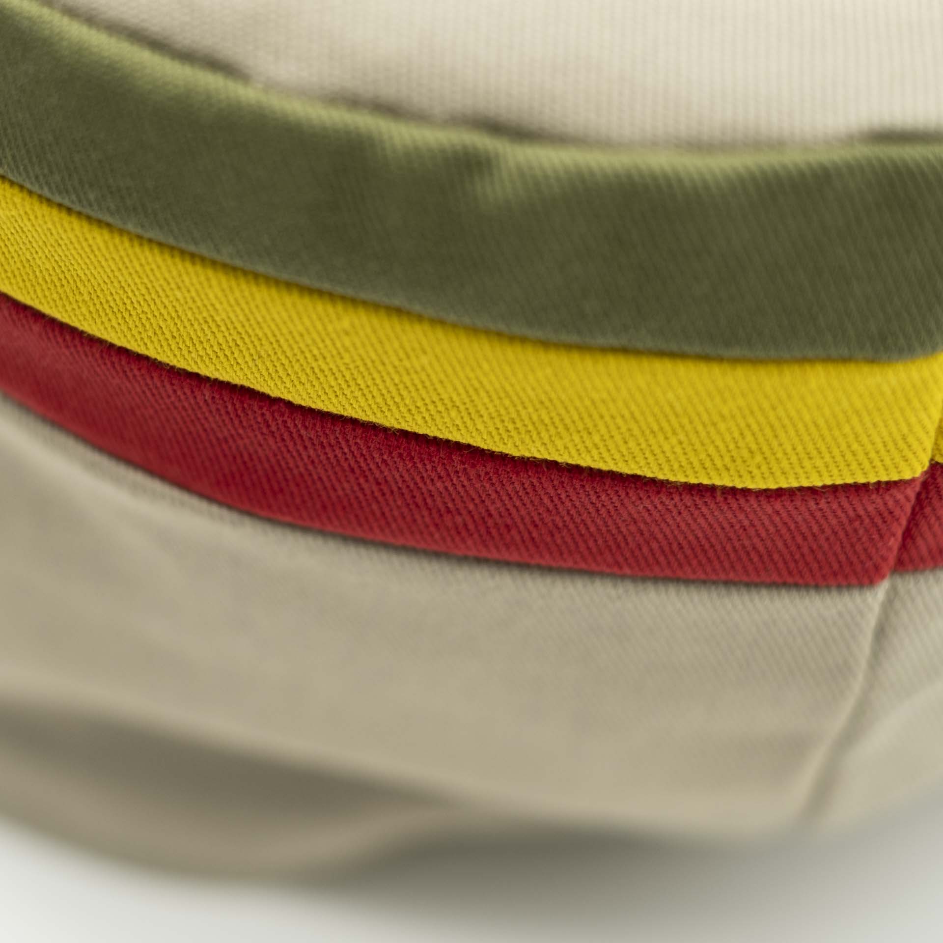 Rasta crown without visor. Beige cotton with red gold and green stripes at the top of the tam.