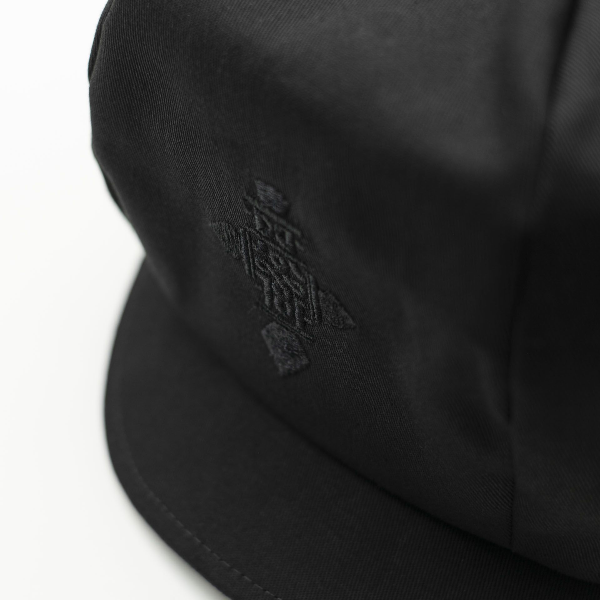 Black cotton rasta hat for dreadlocks with black embroidery of an Ethiopian cross