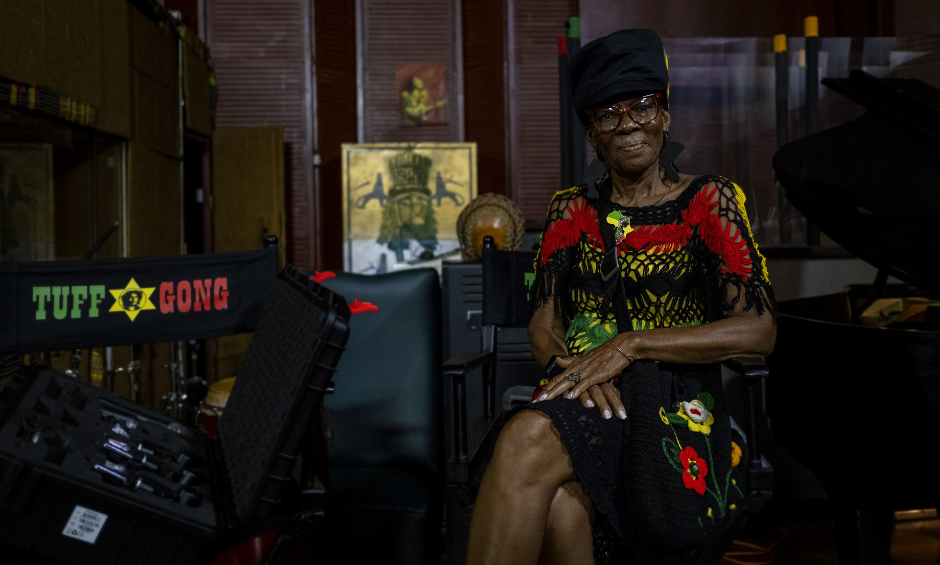 A lady posing with a dreadlocks hat