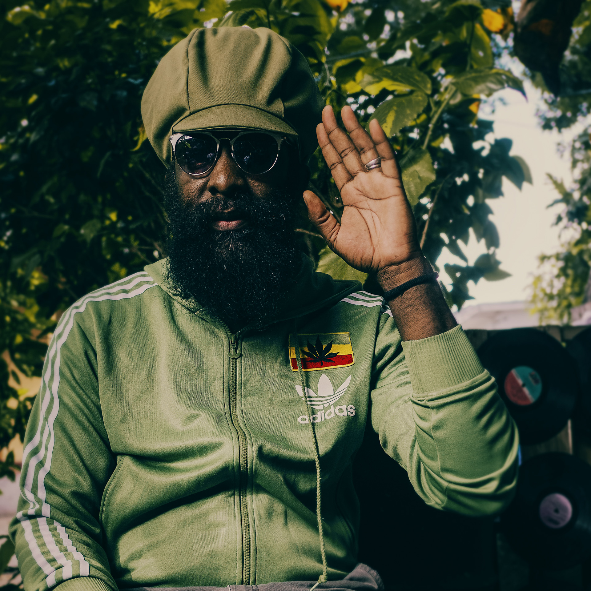 Derajah posing in his yard at Kingston with a beautiful Rocksteady dreadlocks cap