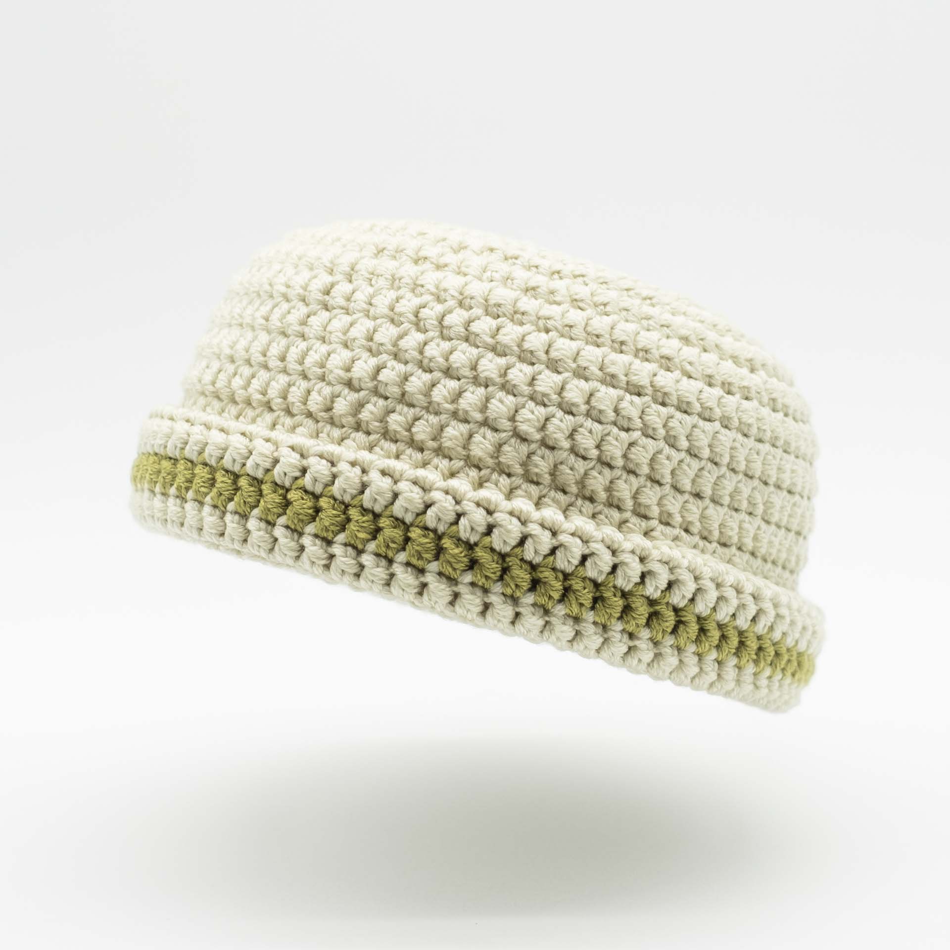 Beanie wool Rasta hat in cream color with a thin khaki green band on the hem