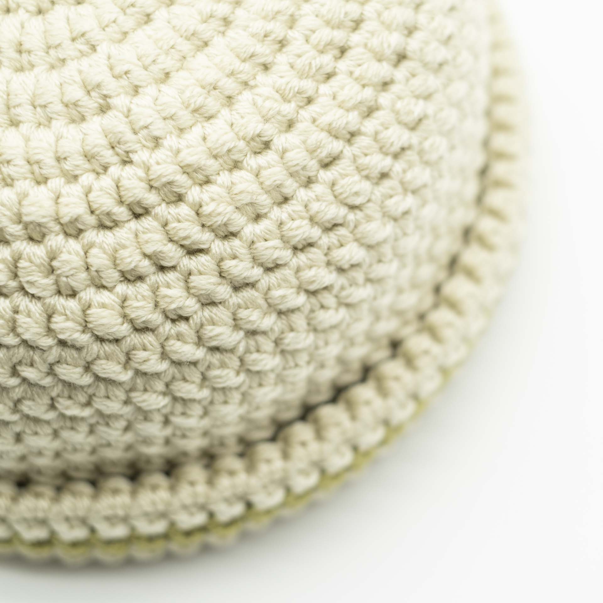 Beanie wool Rasta hat in cream color with a thin khaki green band on the hem