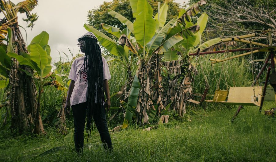 Winston McAnuff wife wearing African dreadlocks tam in his yard in Trelawny