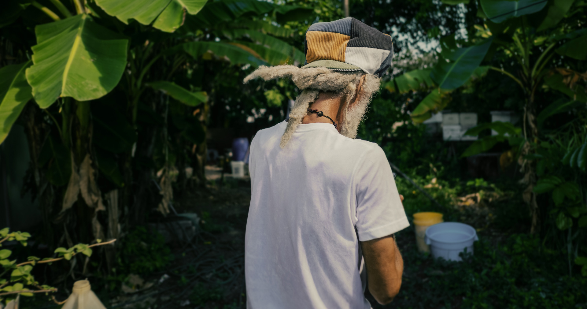 Cedric Myton in his yard at home with a Dreadlocks Nation cap. This rasta hat comes from the Rocksteady collection