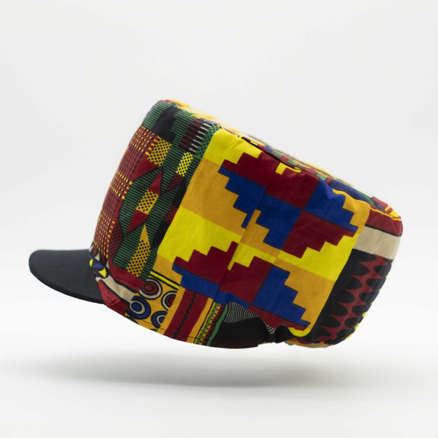 Rasta dreadlocks hat with black visor in light wax fabric with colorful African patterns black lining