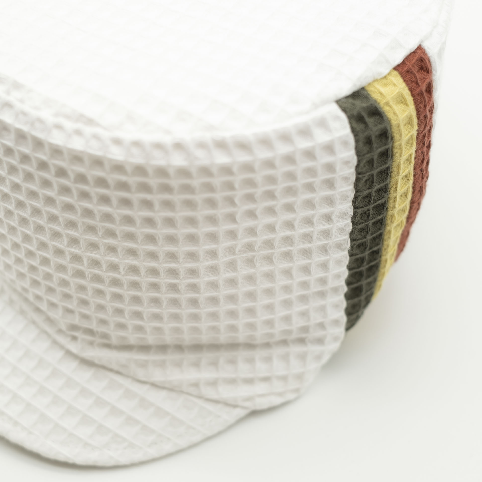 white rasta dreadlocks cap in waffle cotton with red gold green stripe