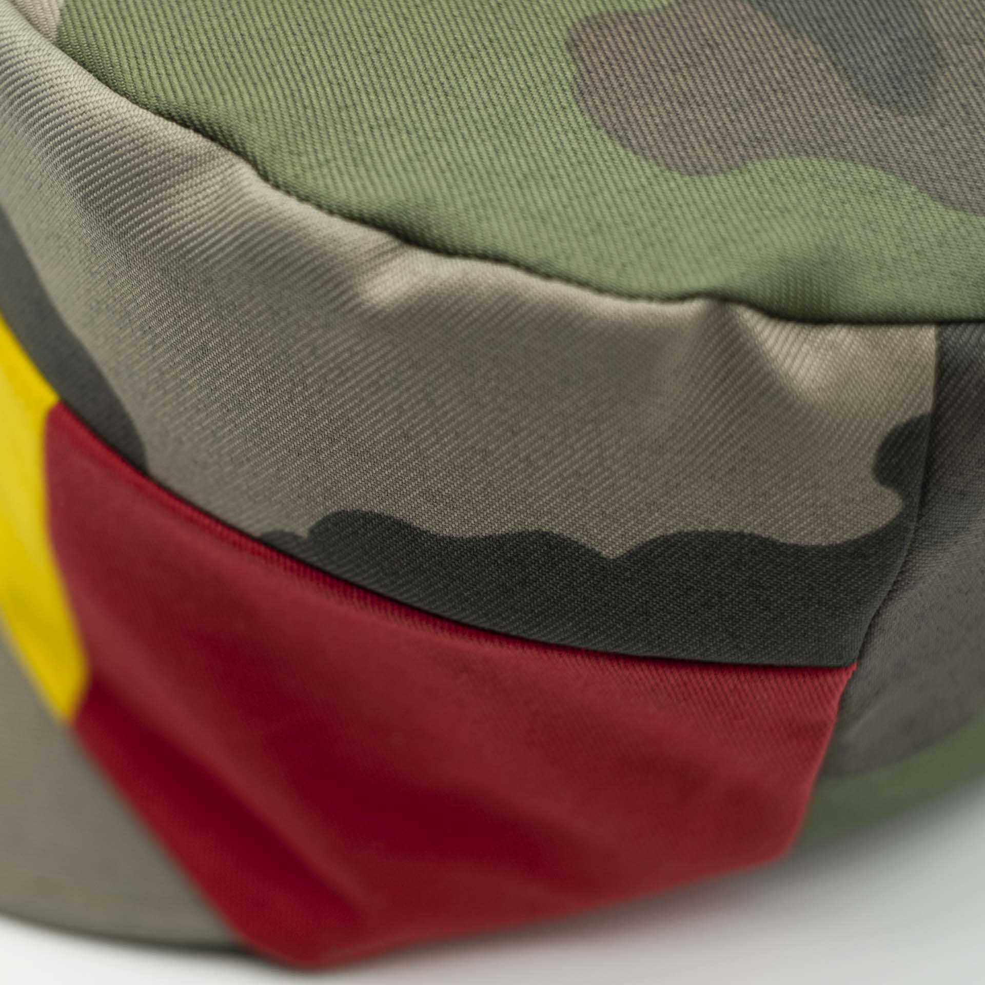 Rasta hat for dreadlocks military camouflage fabric with a red yellow green panel on the front of the hat black lining