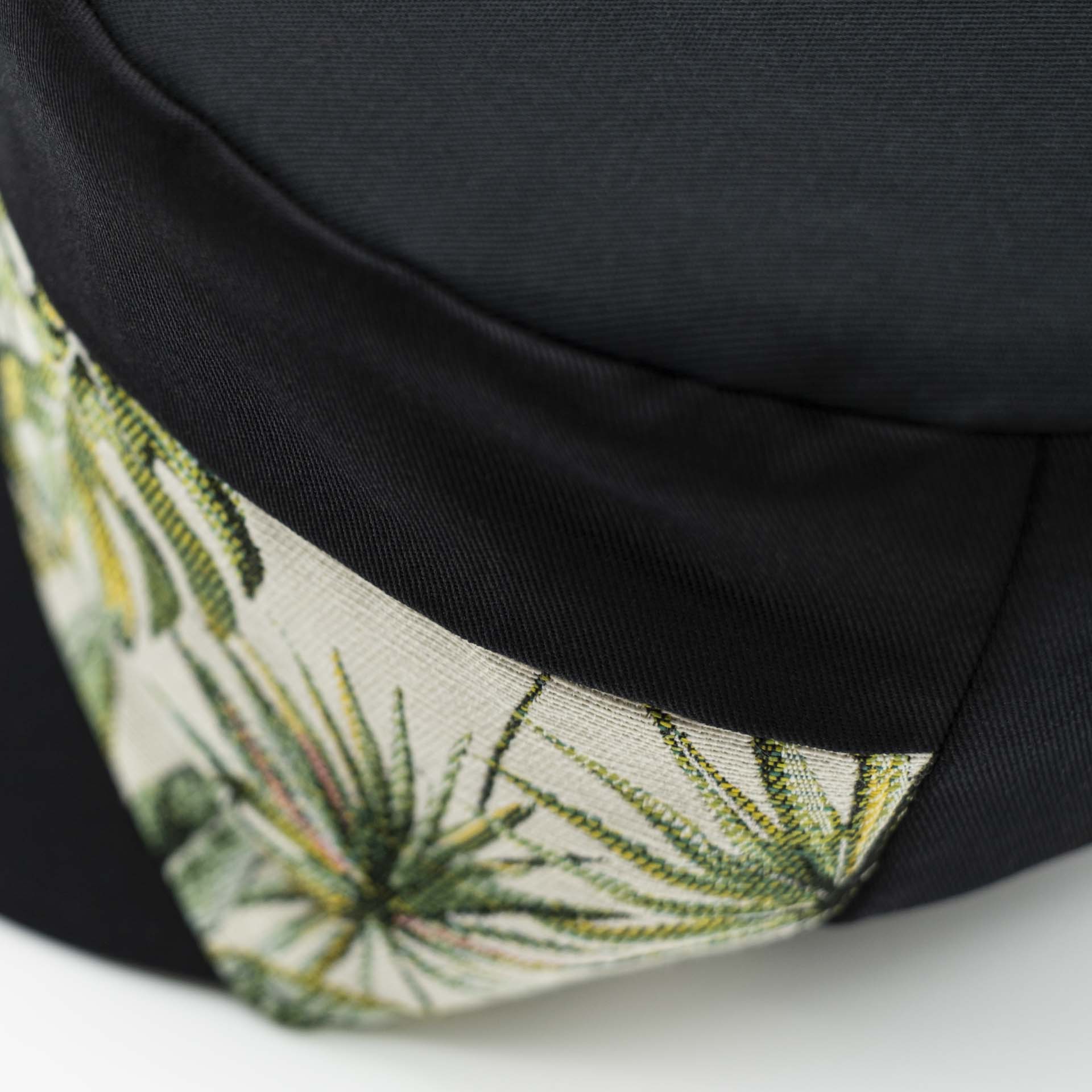 Rasta cap with dreadlocks in black cotton with a front pant in tropical jungle weave black lining