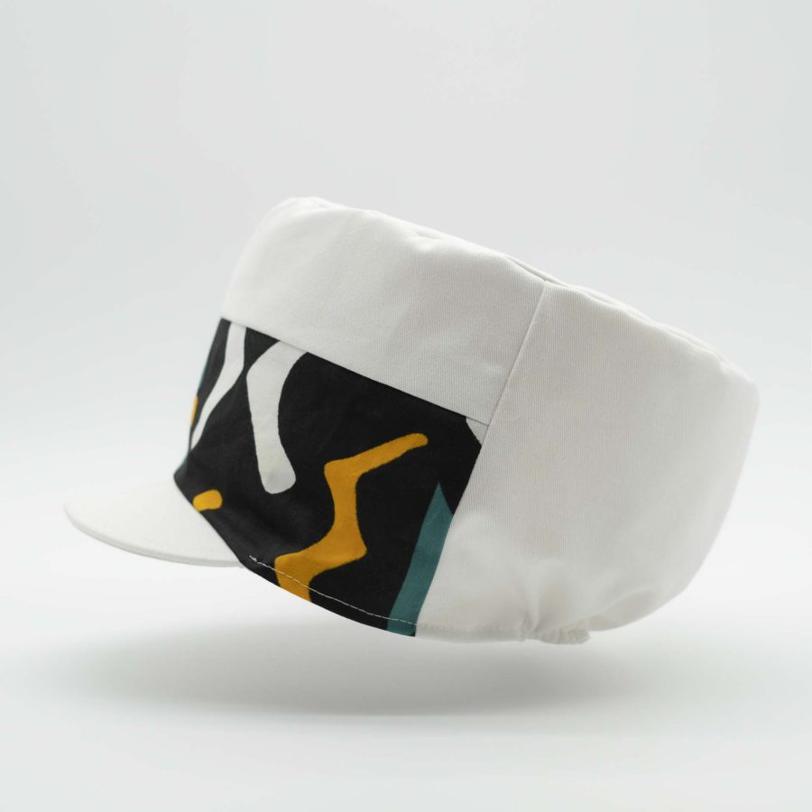 Rasta cap with dreadlocks in white cotton with a front pant facing in wax ethnic patterns white lining