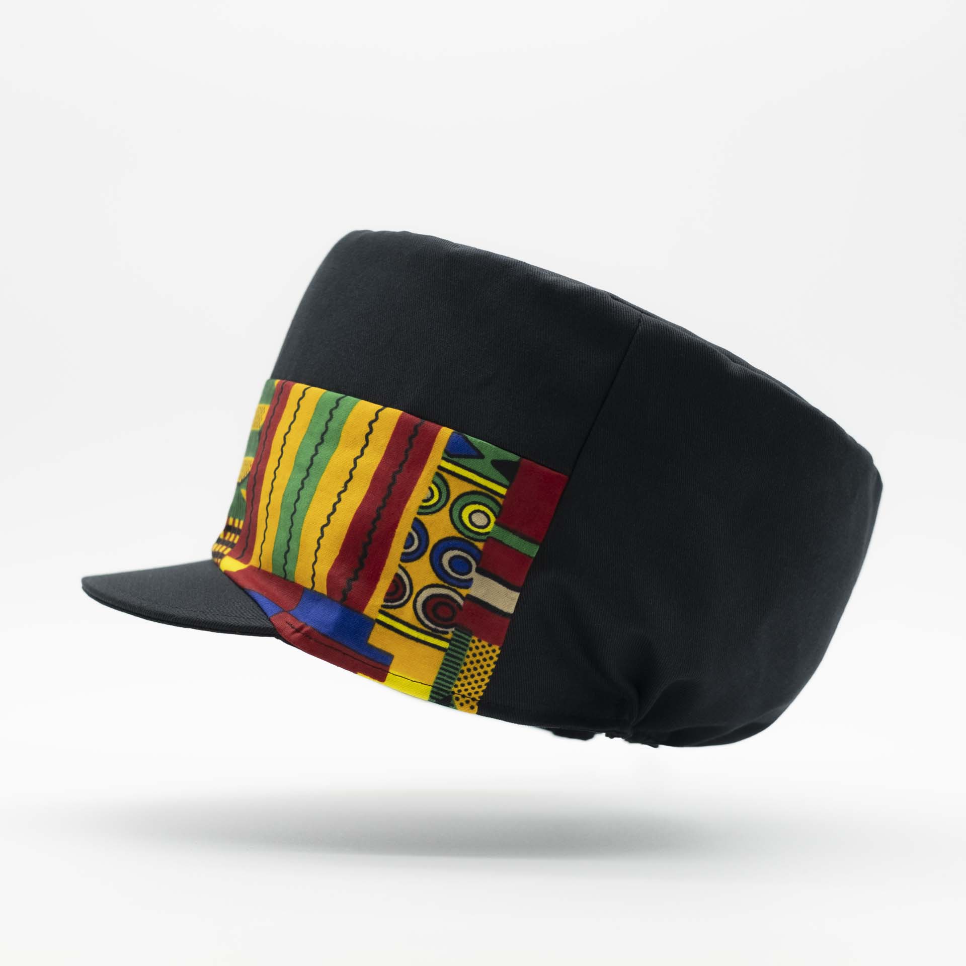 Rasta cap with dreadlocks in black cotton with a front pant in colored wax patterns from Ghana, black lining