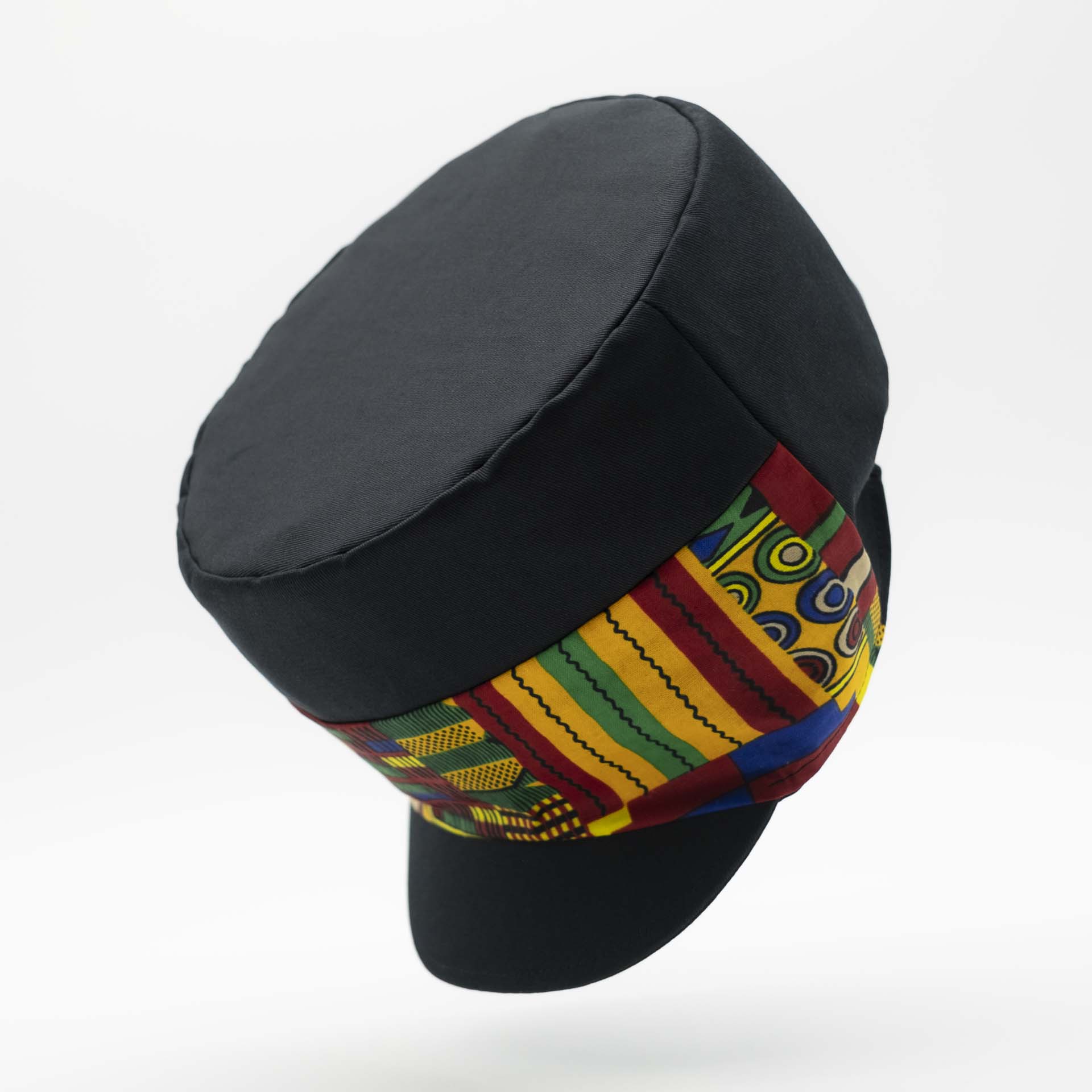 Rasta cap with dreadlocks in black cotton with a front pant in colored wax patterns from Ghana, black lining