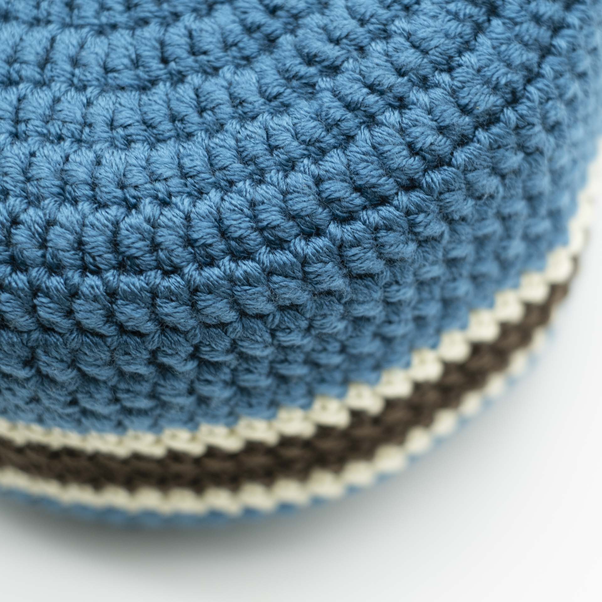 Beanie to put on petrol blue for dreadlocks with a central brown band surrounded by two thin cream bands