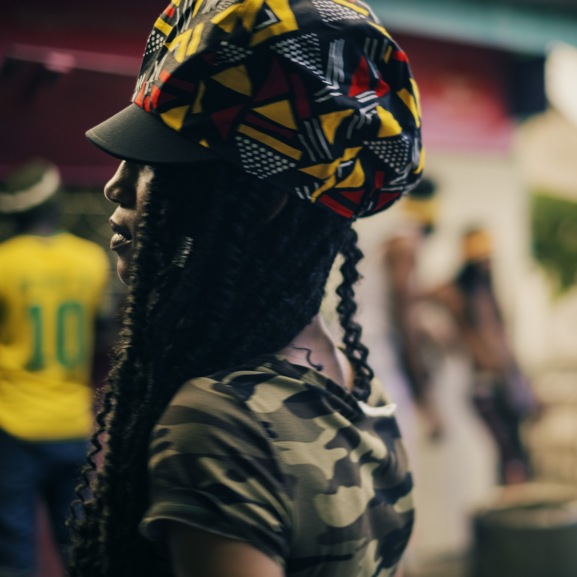 Jamaican woman with dreadlocks wearing a Rasta crown black red and yellow