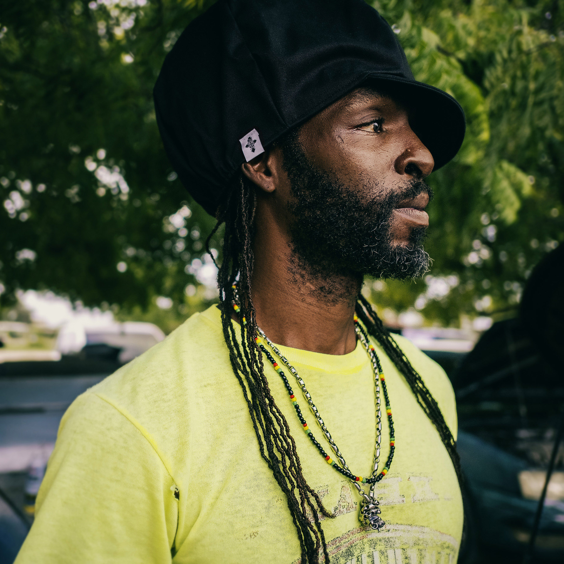 Portrait of a Jamaican wearing a pure black Dreadlocks Nation hat