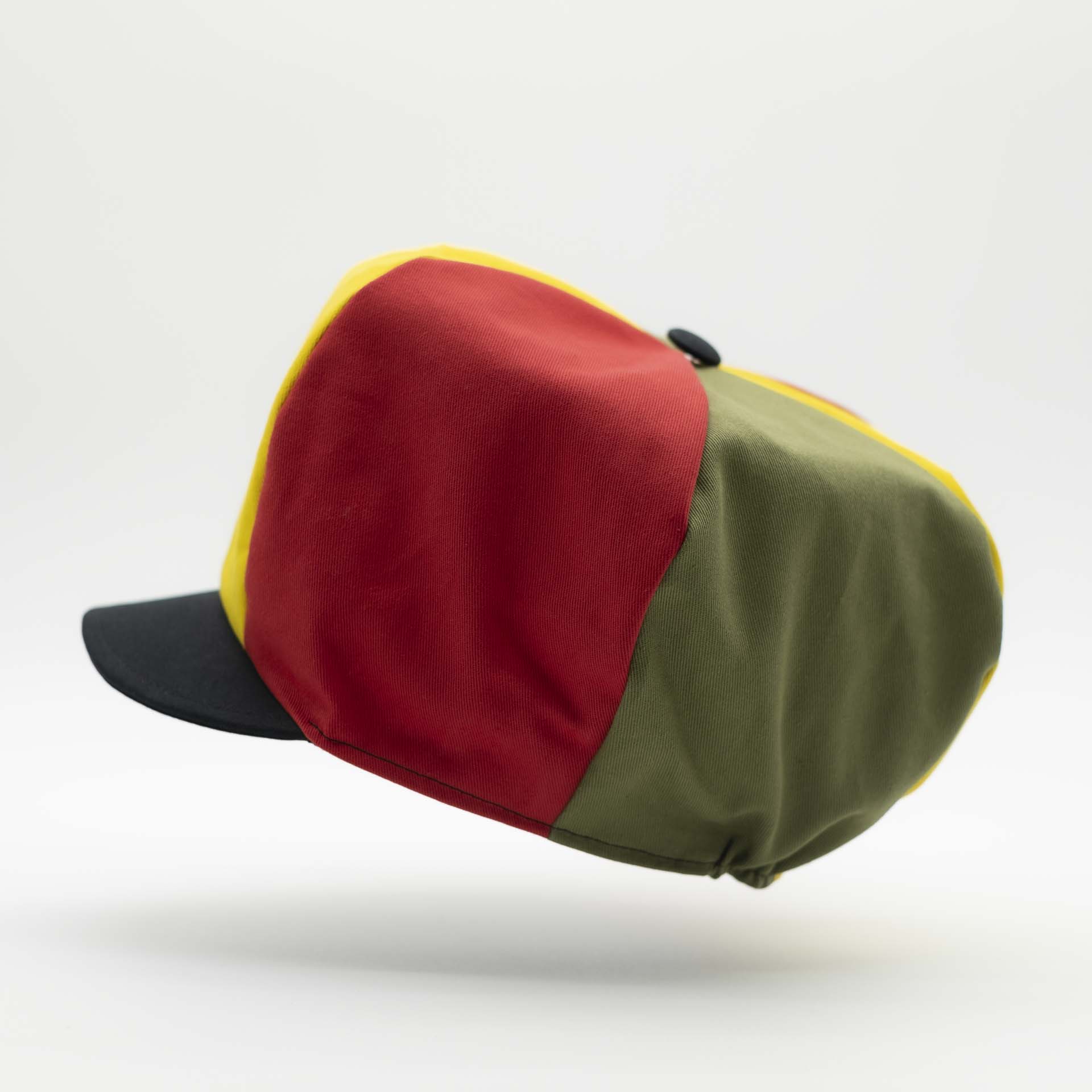 Rasta newsboy cap with black visor for dreadlocks in green yellow and red cotton in the colors of Ethiopia and black lining