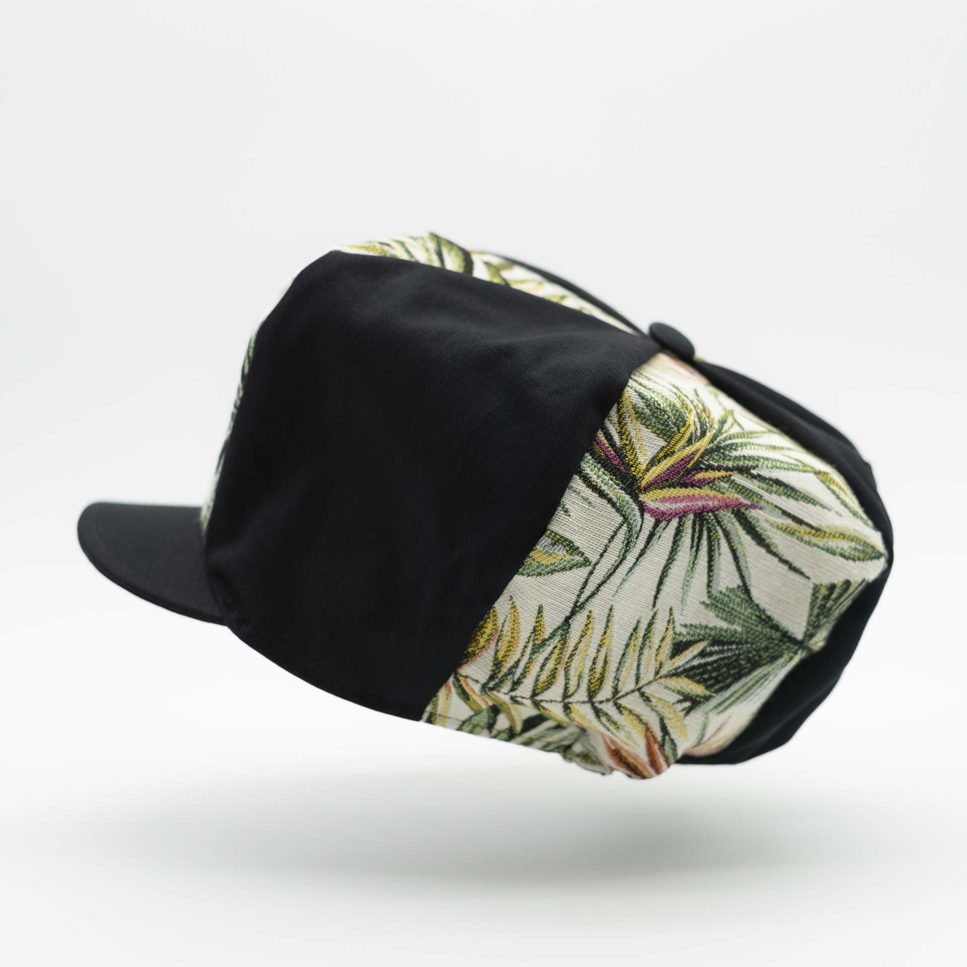 Rasta newsboy cap with visor with mix of black cotton and tropical jungle weave black lining