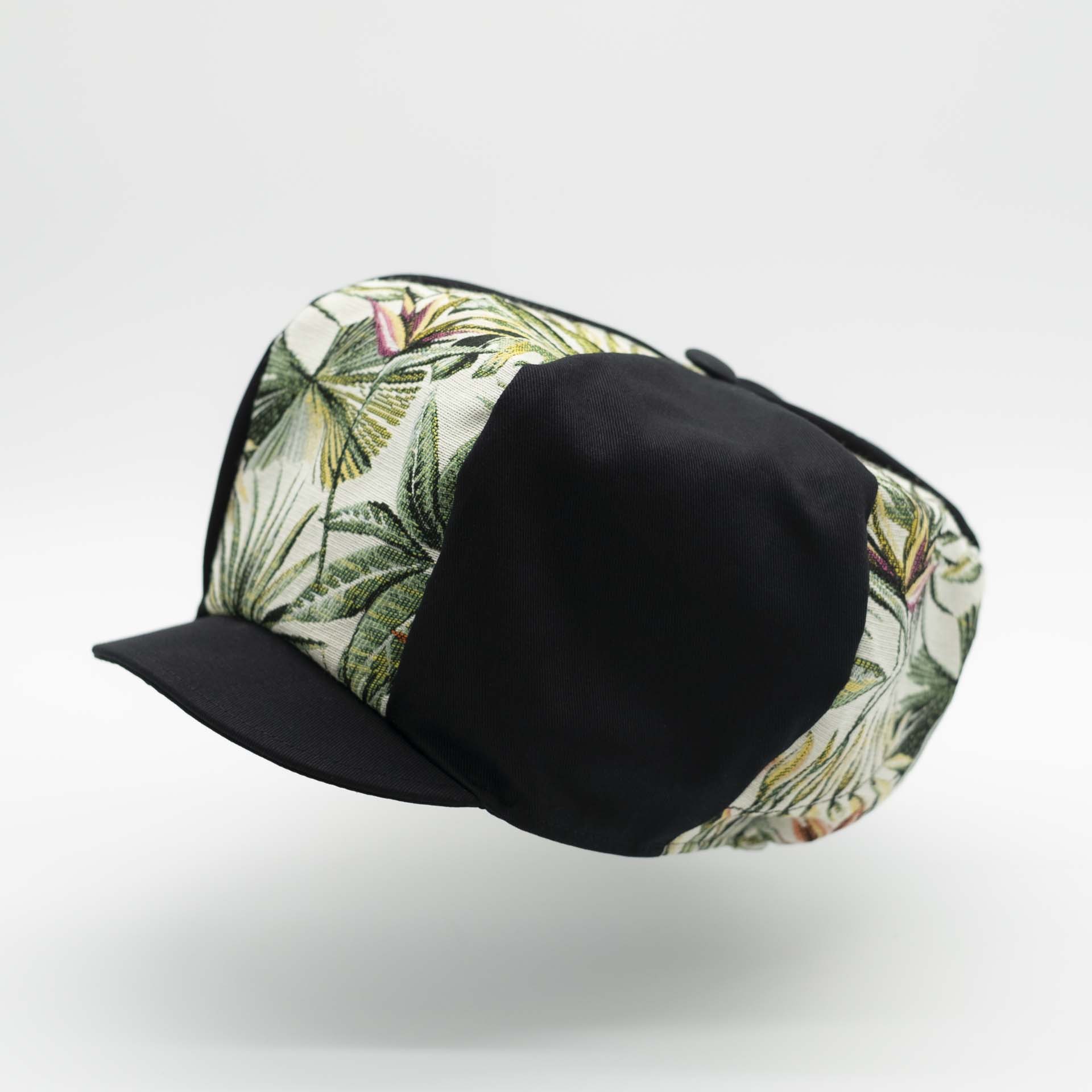 Rasta newsboy cap with visor with mix of black cotton and tropical jungle weave black lining