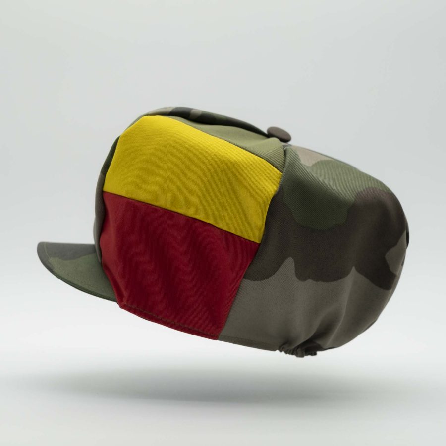 Rasta cap with visor for dreadlocks in military camouflage with three stripes green yellow red on one side of the hat and black lining