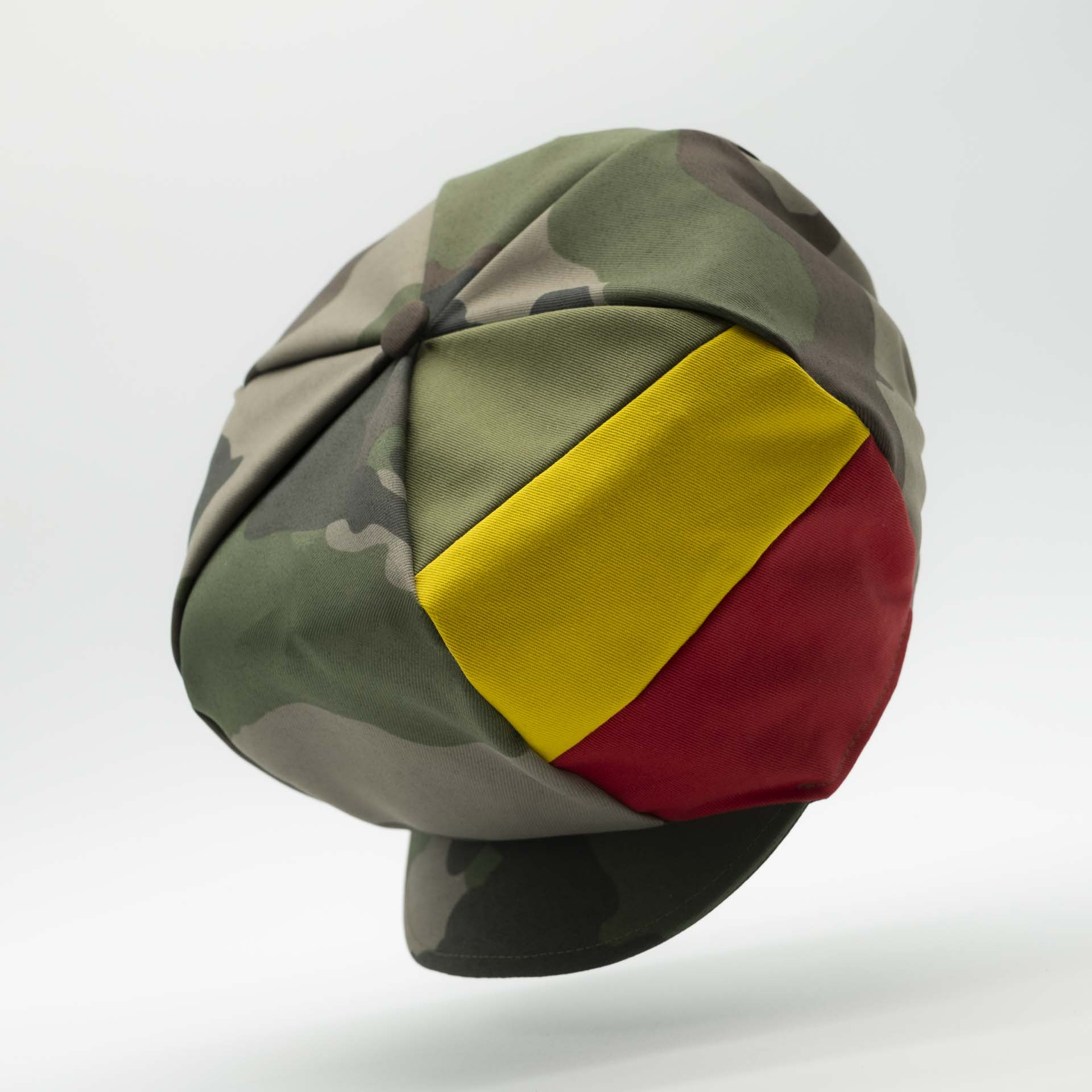 Rasta cap with visor for dreadlocks in military camouflage with three stripes green yellow red on one side of the hat and black lining