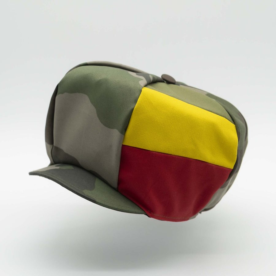 Rasta cap with visor for dreadlocks in military camouflage with three stripes green yellow red on one side of the hat and black lining