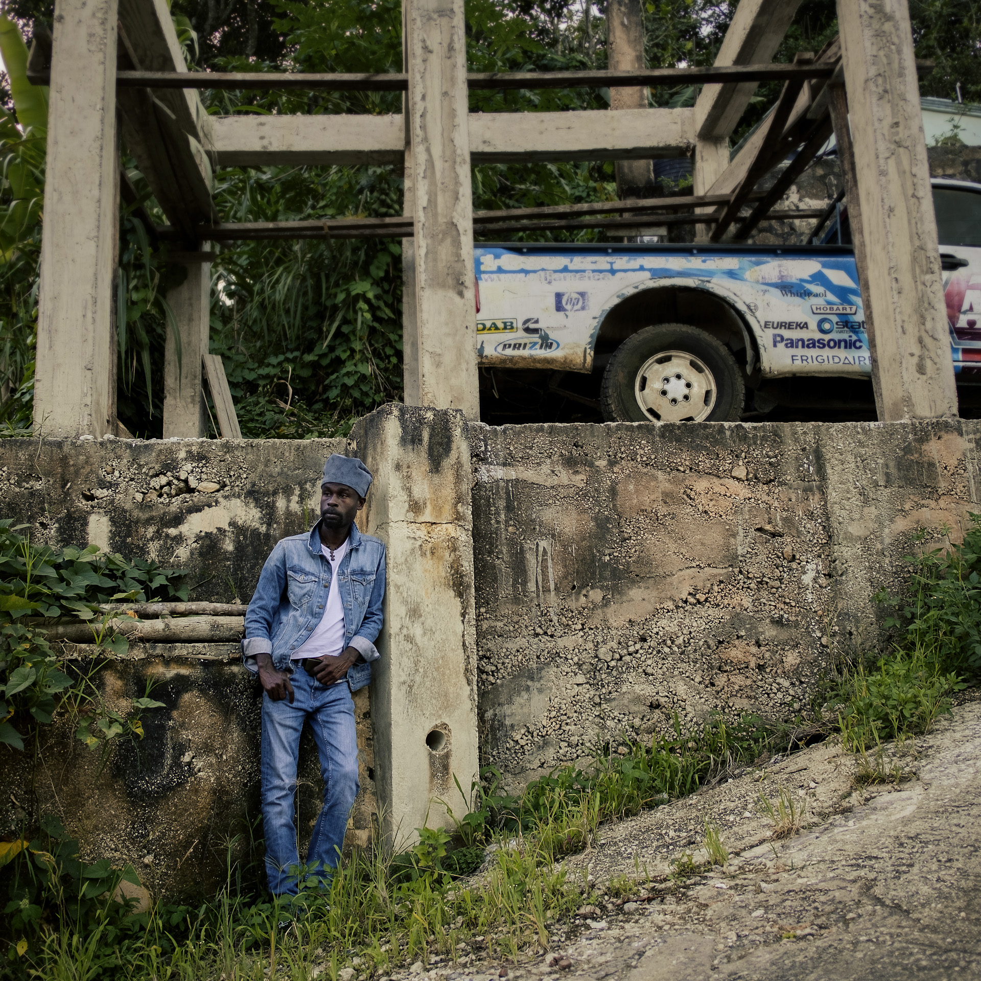 Carron Mc Gibbon posing at Trelawny Jamaica for a blue corduroy Rasta hat