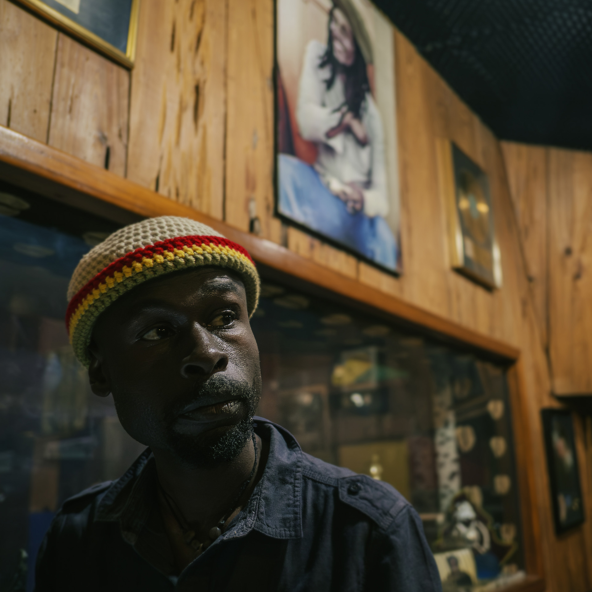 Jamaican Artist Carron Mc Gibbon wearing a fisherman collection Rasta hat in Bob Marley's studio at Trenchtown
